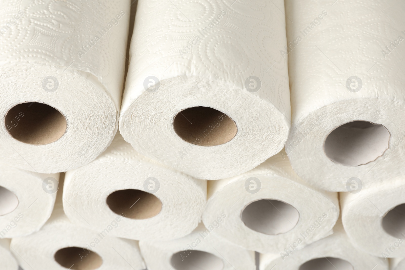 Photo of Rolls of paper towels as background, closeup view