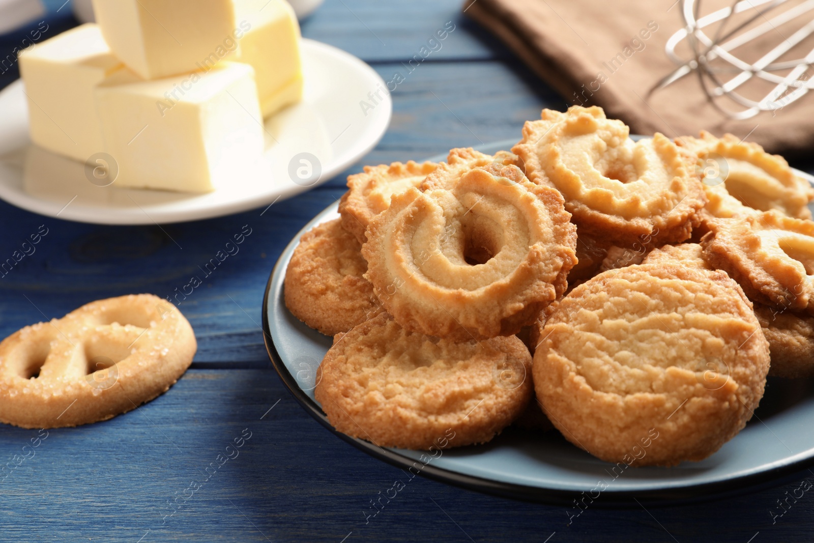 Photo of Plate with Danish butter cookies on table. Space for text