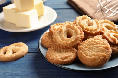 Plate with Danish butter cookies on table. Space for text