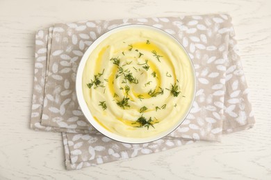 Photo of Freshly cooked homemade mashed potatoes on white wooden table, top view