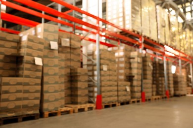 Image of Warehouse with lots of products, blurred view. Wholesale business