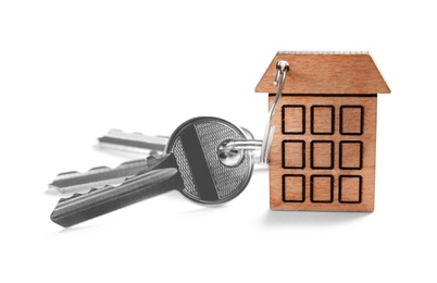 House keys with trinket on white background