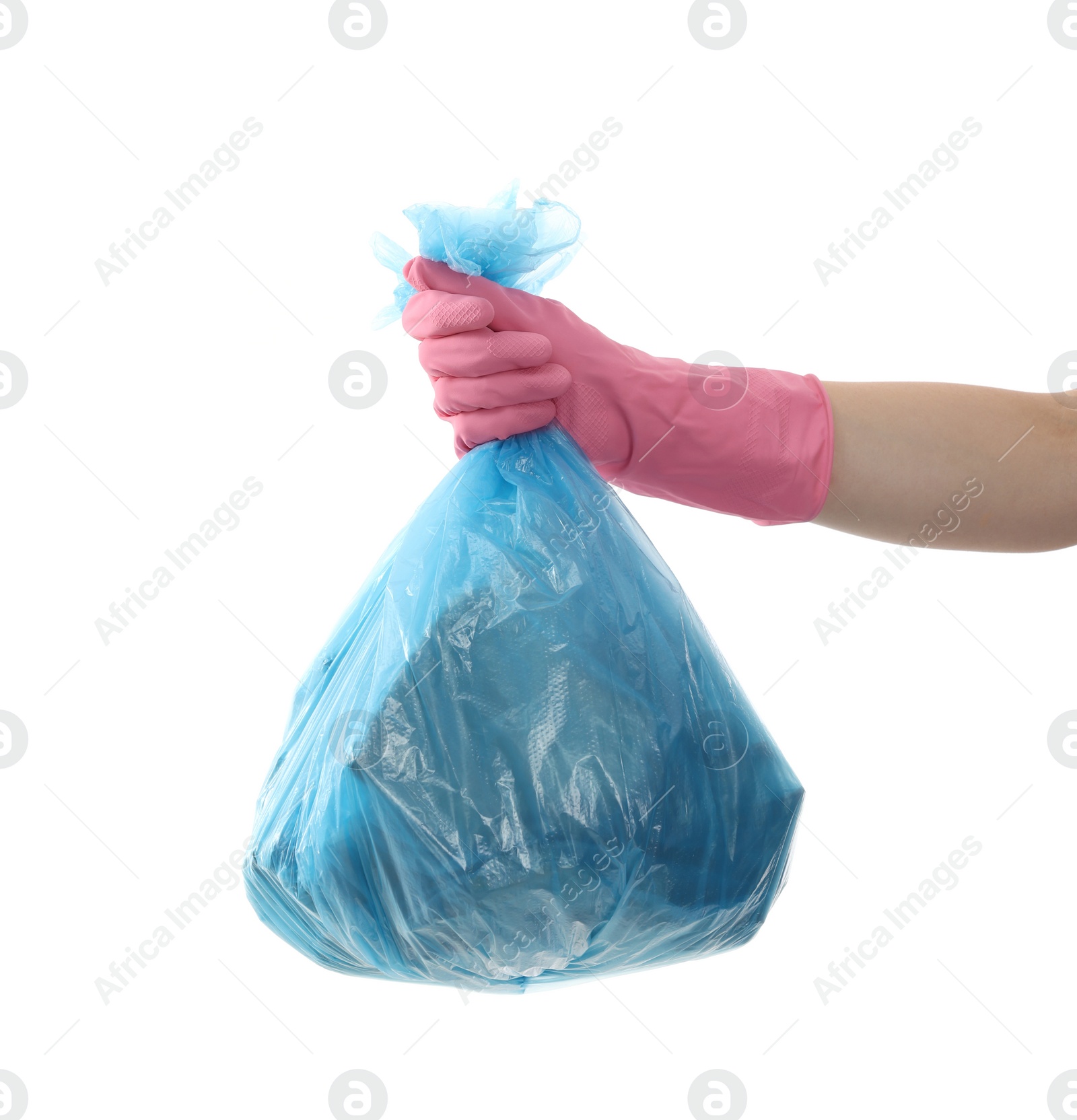 Photo of Woman holding plastic bag full of garbage on white background, closeup