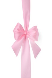 Pink satin ribbon with bow isolated on white, top view