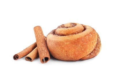 One tasty cinnamon roll and sticks isolated on white