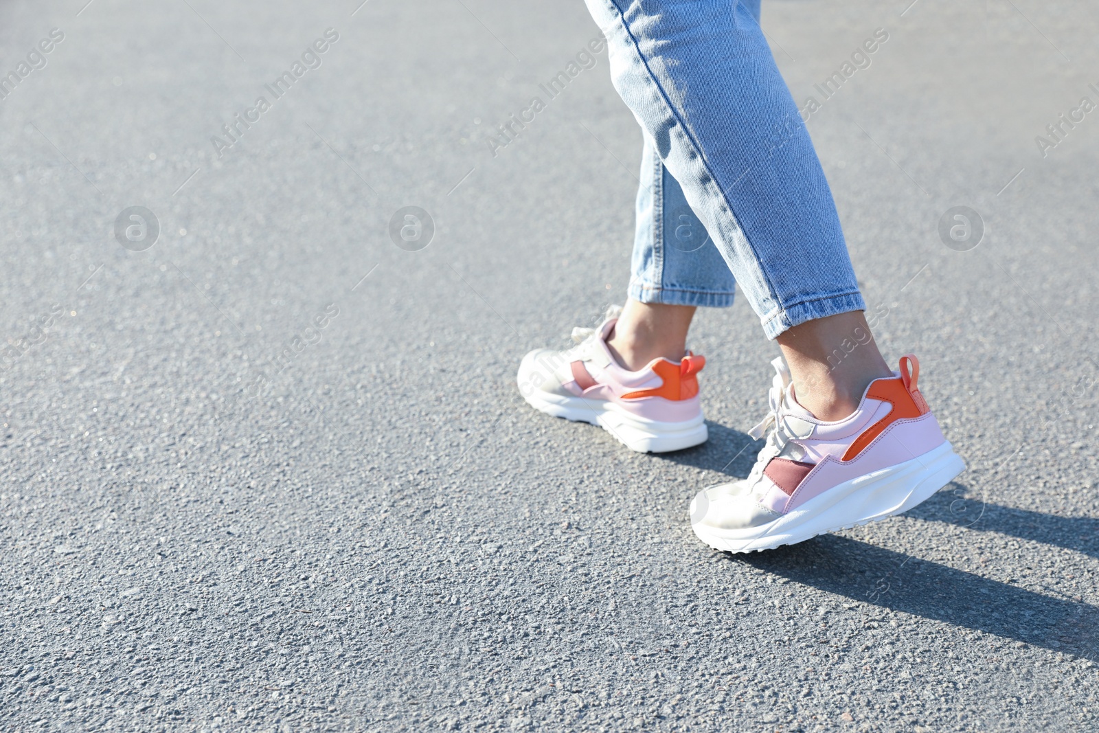 Photo of Woman walking outdoors, closeup with space for text. Choosing way concept.