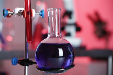 Photo of Stand with glass flask in chemistry laboratory, closeup