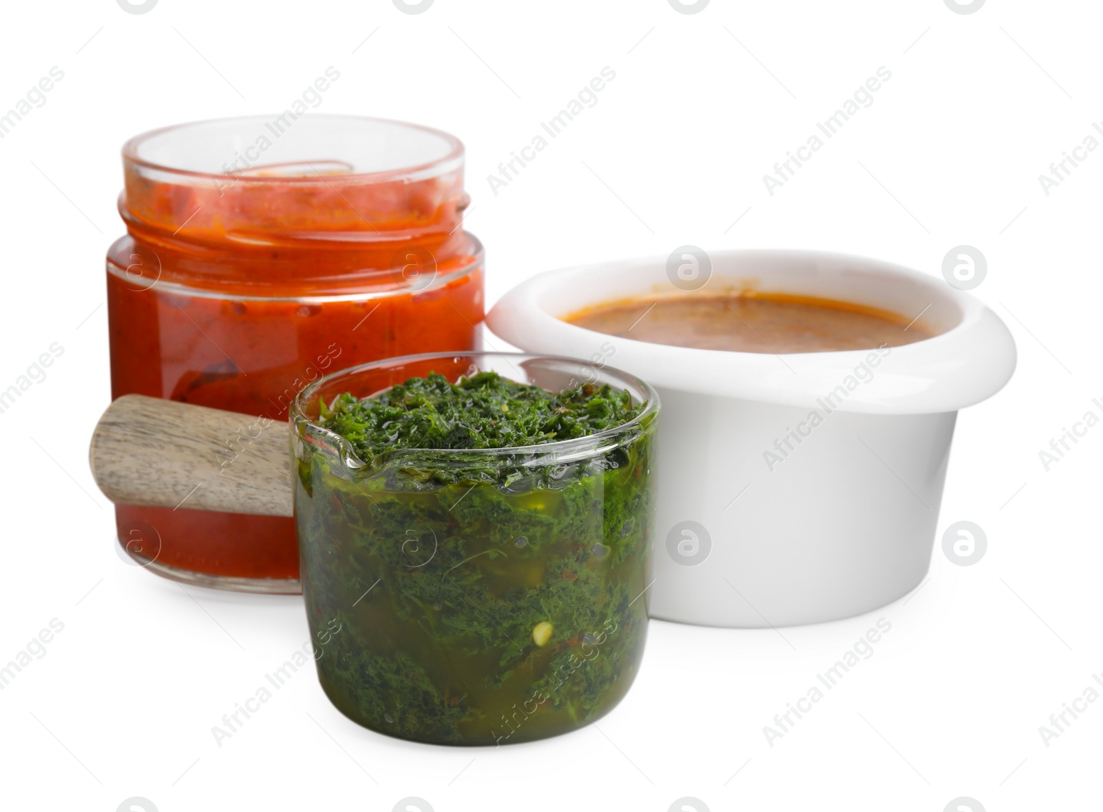 Photo of Different marinades in tableware isolated on white