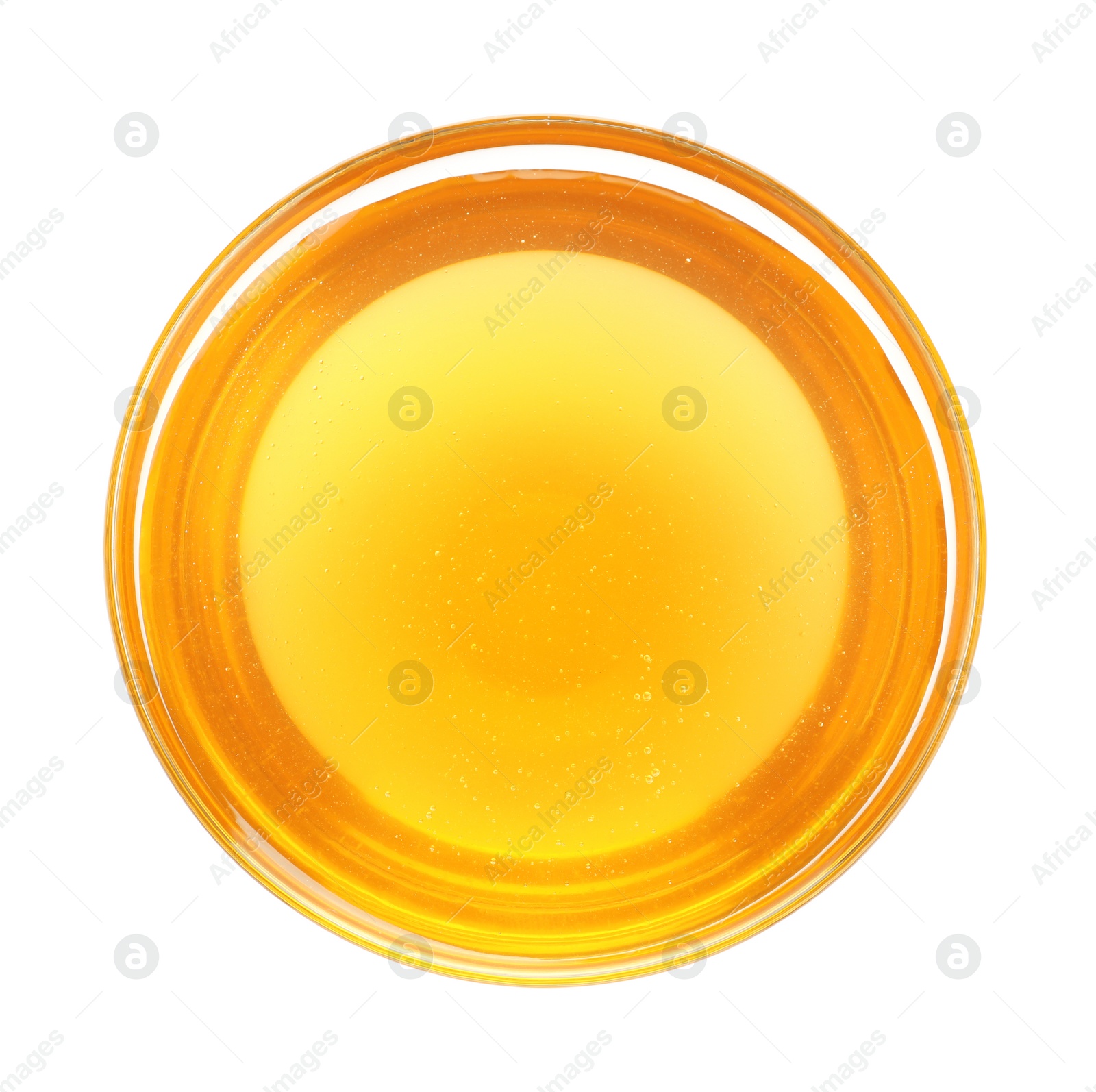Photo of Bowl of organic honey isolated on white, top view