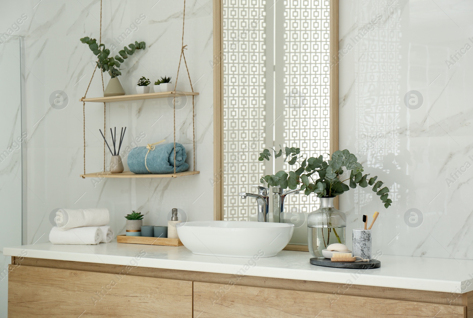 Photo of Modern bathroom interior with stylish mirror and vessel sink