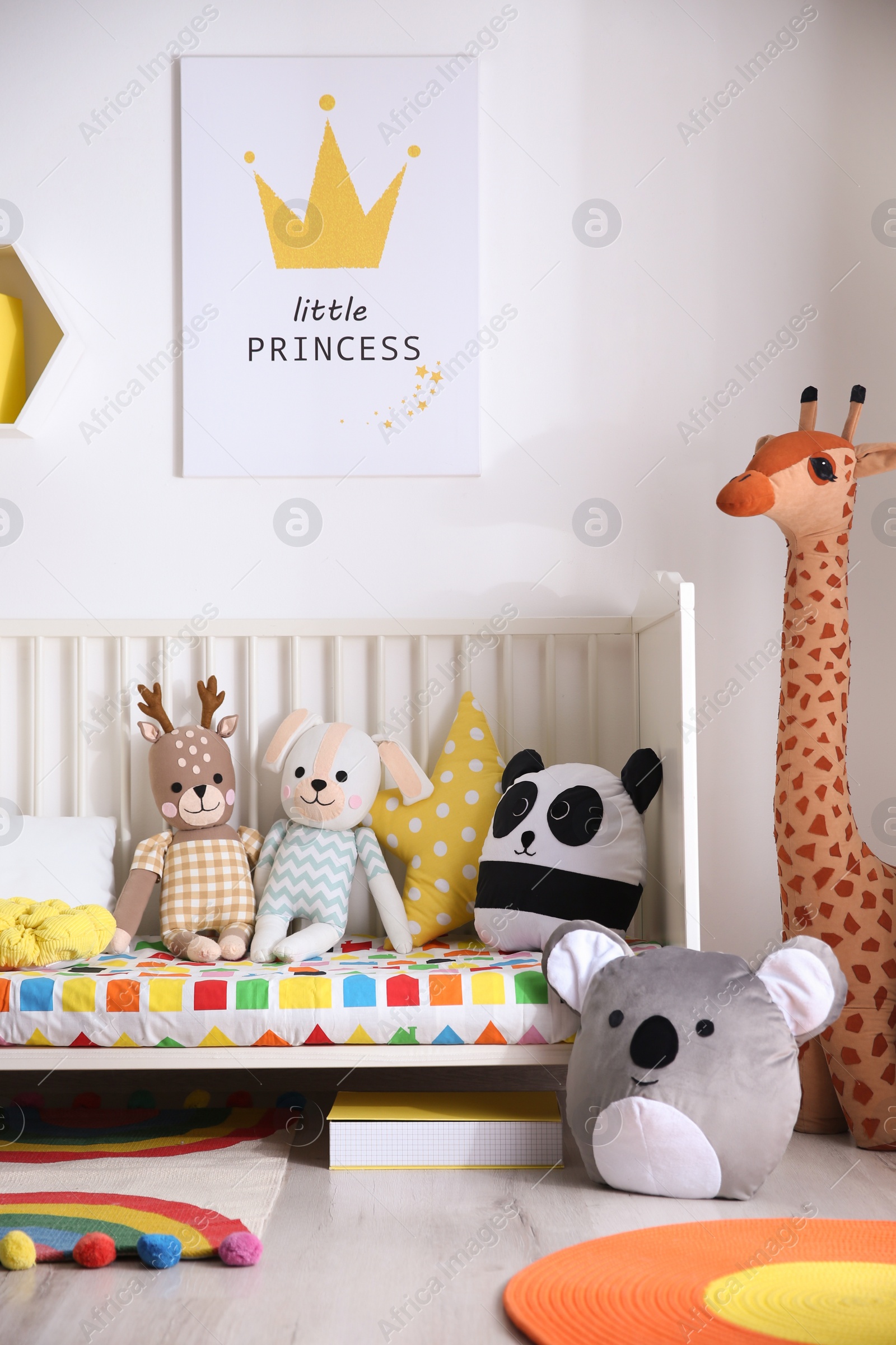 Photo of Baby room interior with stylish furniture and toys