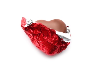 Photo of Heart shaped chocolate candy in red foil on white background, top view