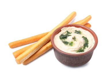 Delicious hummus with grissini sticks isolated on white