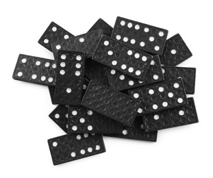Photo of Pile of black domino tiles on white background, top view