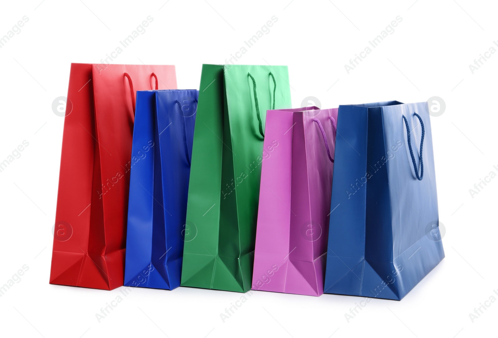 Photo of Colorful paper shopping bags isolated on white