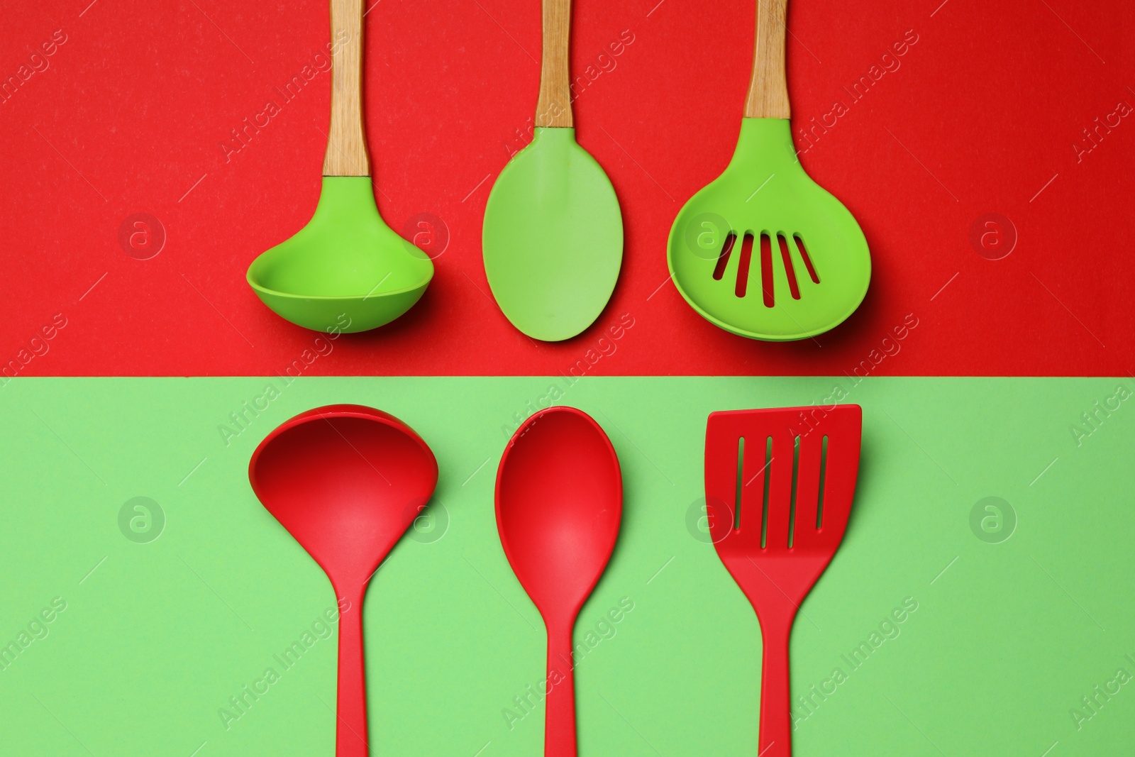 Photo of Set of modern cooking utensils on color background, flat lay