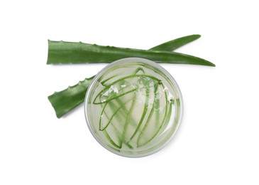 Photo of Tasty aloe juice in glass and cut leaves isolated on white, top view