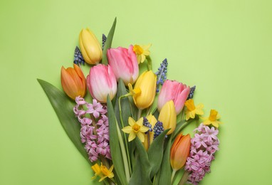 Photo of Beautiful bouquet of different flowers on green background, flat lay. Space for text