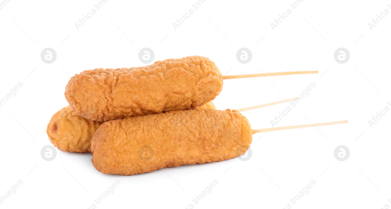 Photo of Delicious deep fried corn dogs isolated on white