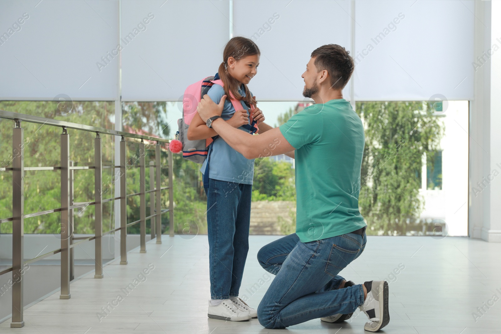 Photo of Father saying goodbye to his daughter in school