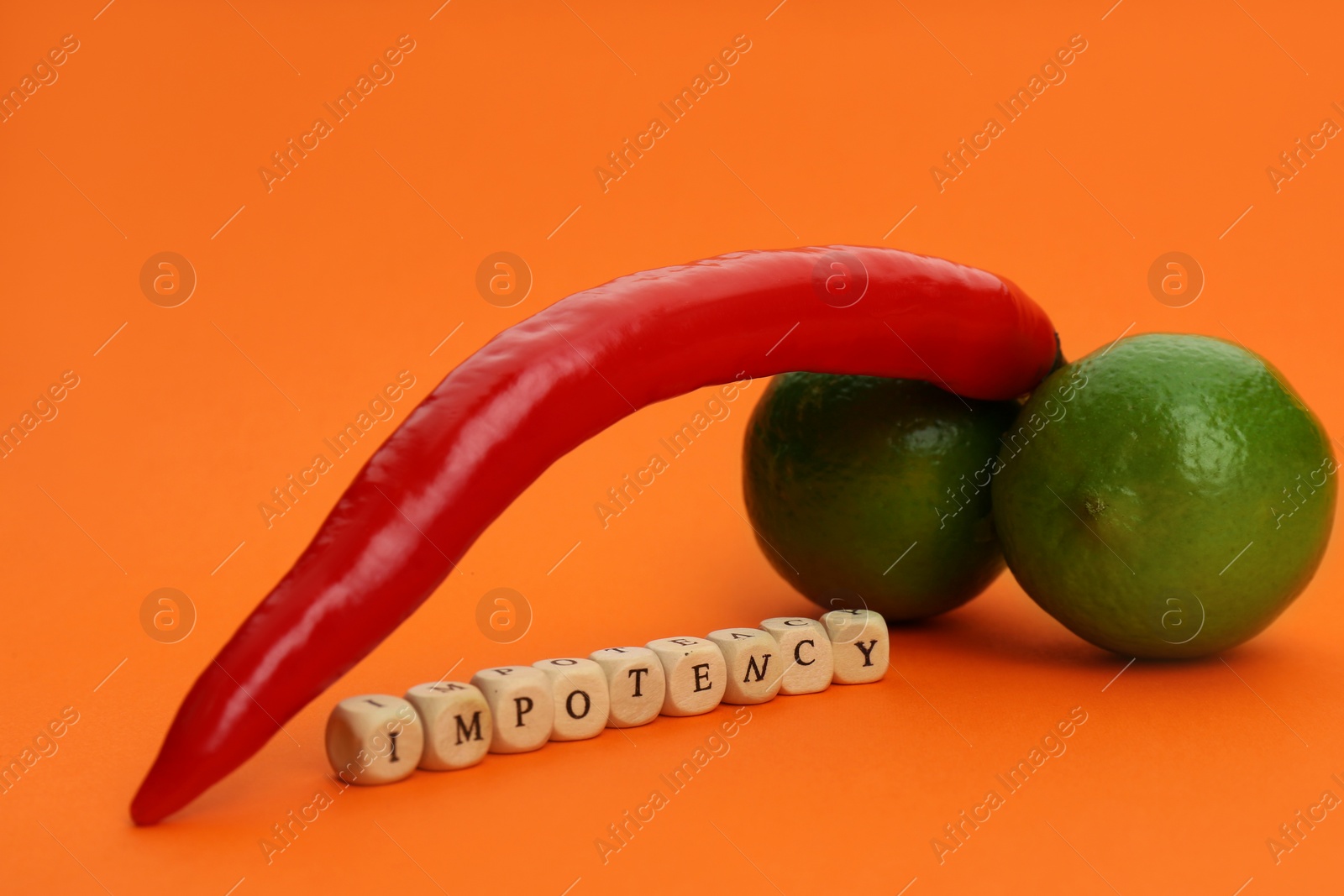 Photo of Products symbolizing male sexual organ and word IMPOTENCY on orange background