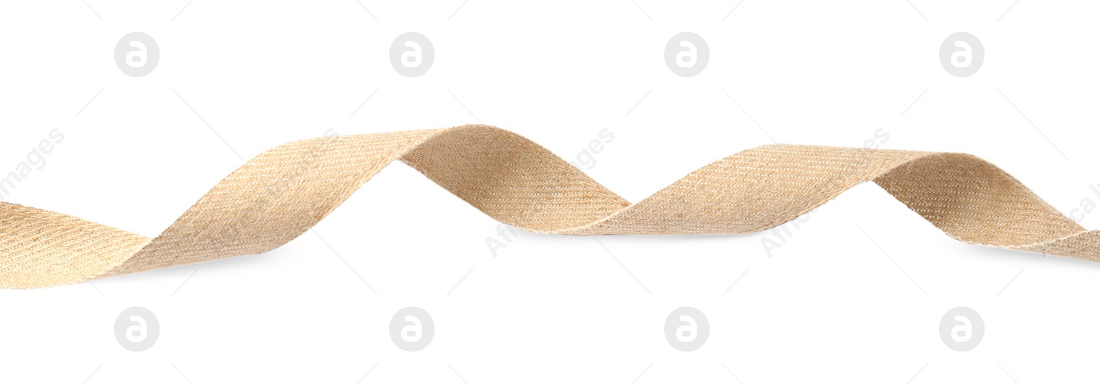 Photo of Burlap ribbon isolated on white. Organic fabric