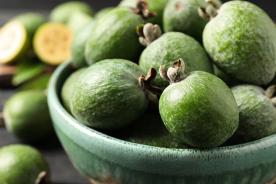 Fresh green feijoa fruits in bowl, closeup