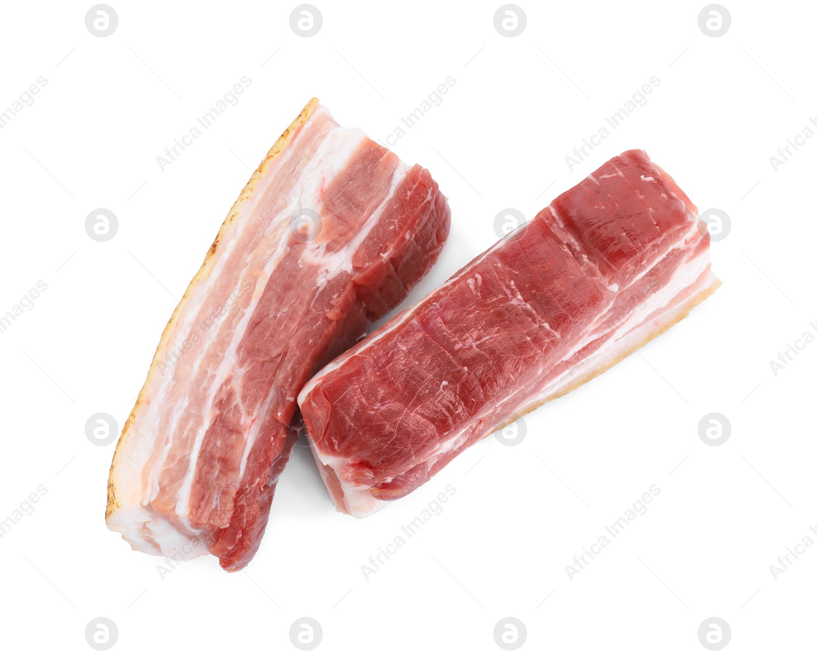 Photo of Pieces of raw pork belly isolated on white, top view