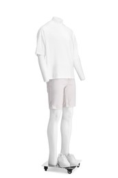 Photo of Male mannequin with shoes dressed in stylish t-shirt and shorts isolated on white