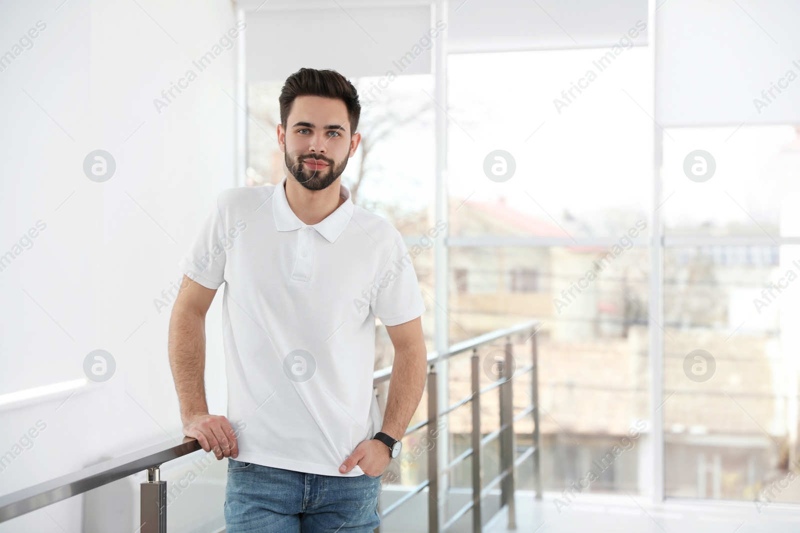 Photo of Portrait of handsome man in light room