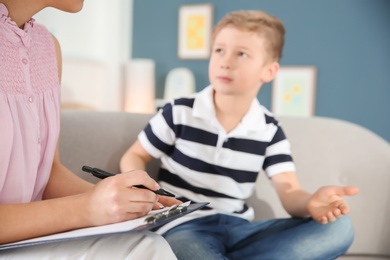 Cute little boy at child psychologist's office