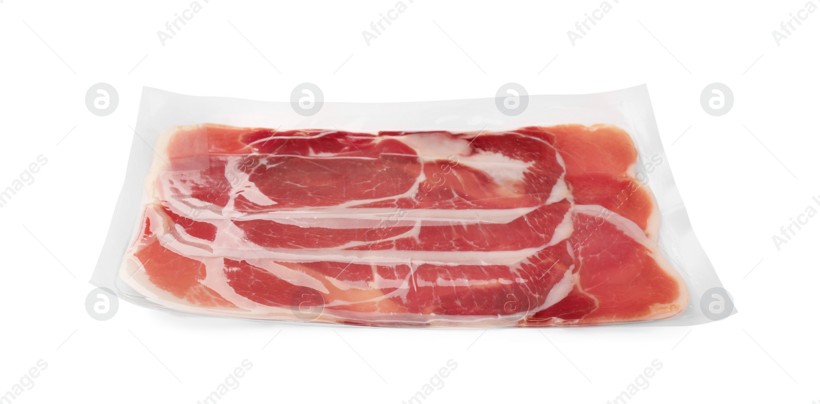 Photo of Pack of delicious sliced jamon isolated on white