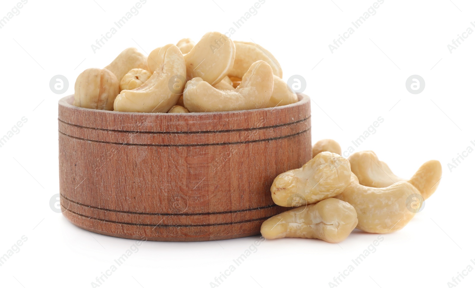 Photo of Bowl and tasty organic cashew nuts isolated on white