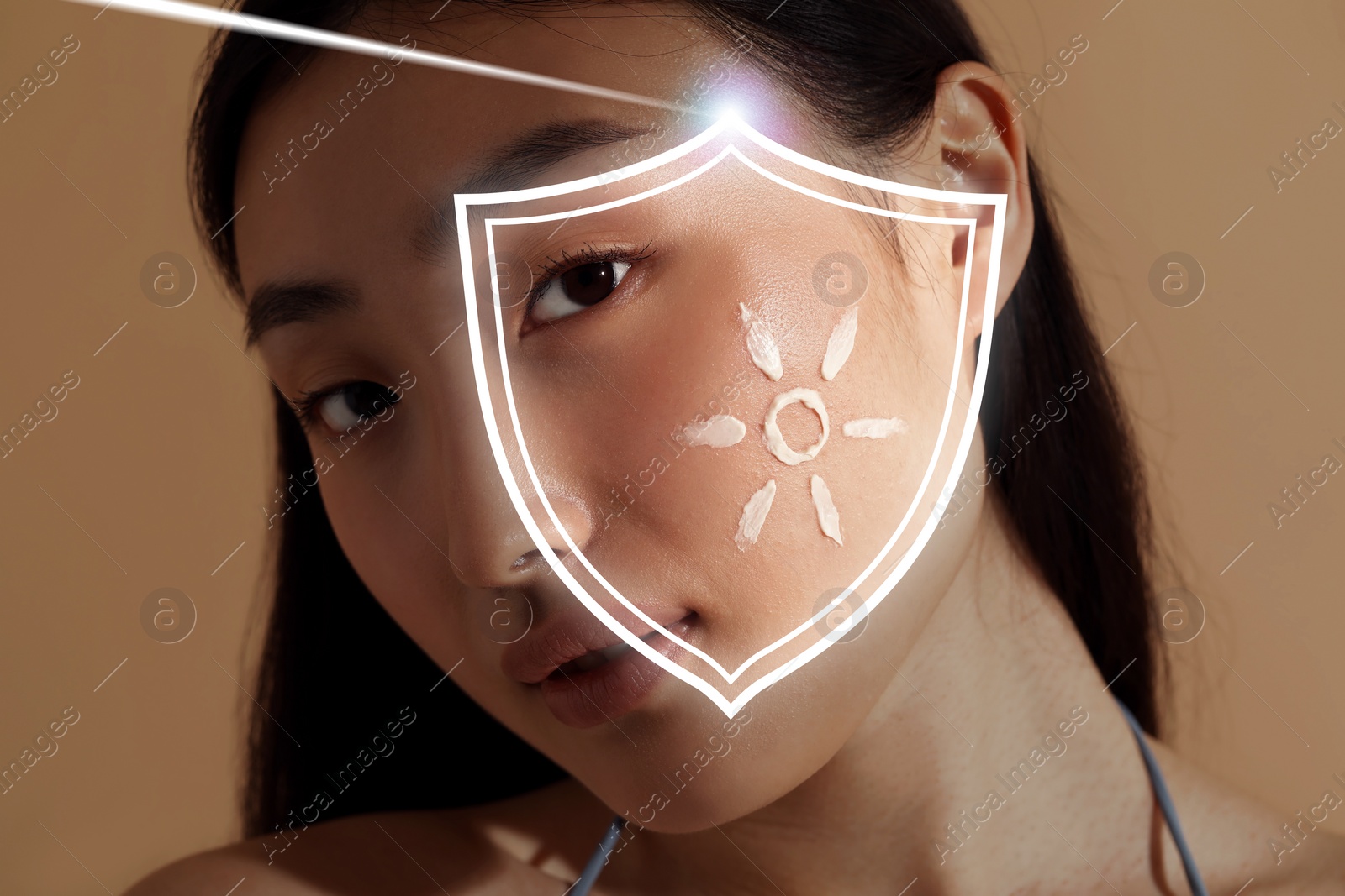 Image of Sun protection care. Beautiful woman with sunscreen on face against beige background. Illustration of shield as SPF