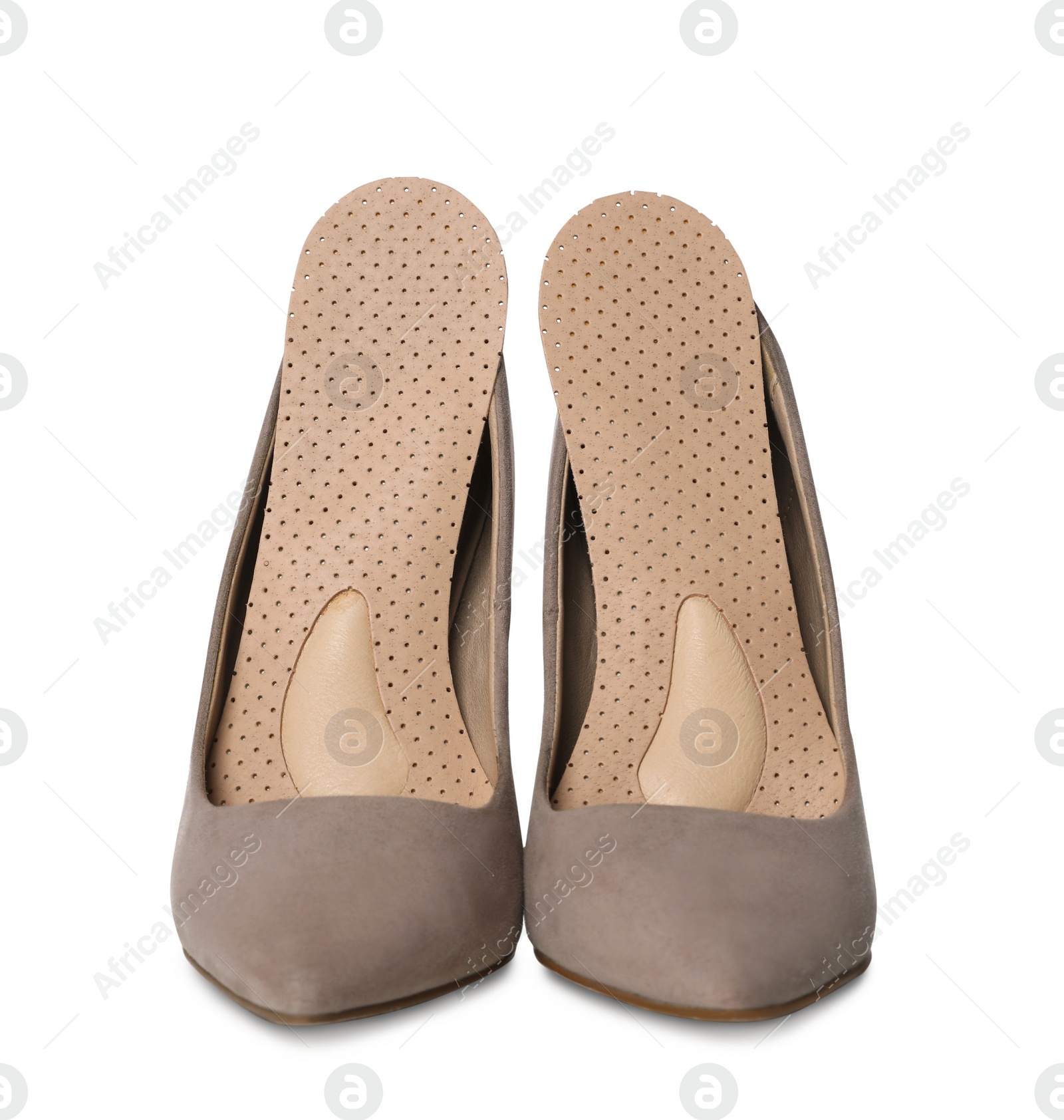 Photo of Orthopedic insoles in high heel shoes on white background