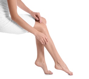 Photo of Woman with beautiful legs and feet on white background, closeup. Spa treatment