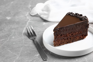 Delicious fresh chocolate cake served on grey table