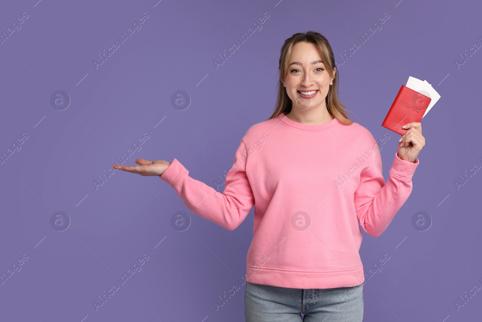 Photo of Happy young woman with passport and ticket on purple background, space for text