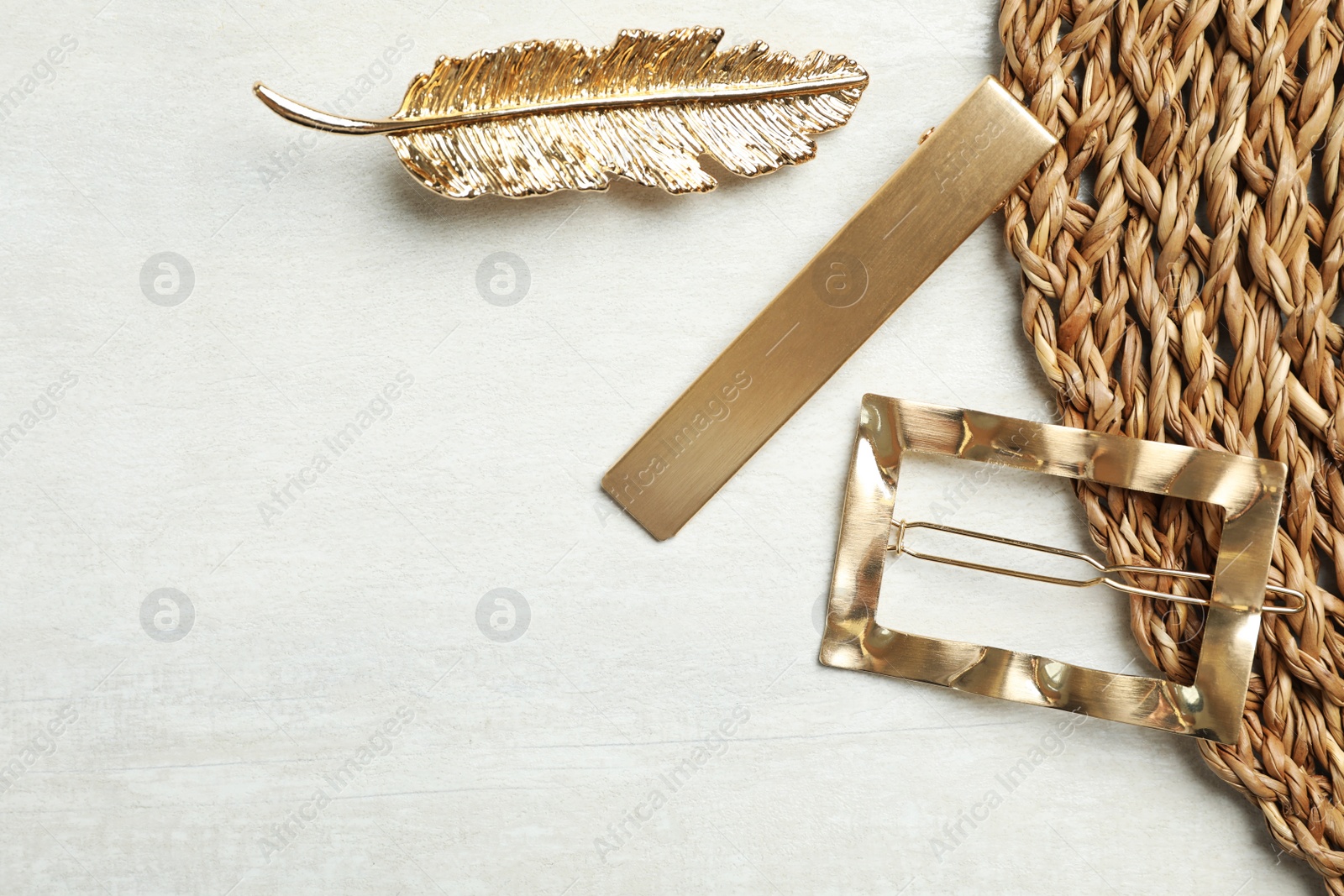 Photo of Beautiful different hair clips on white table, flat lay