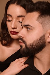 Photo of Handsome bearded man with sexy lady, closeup