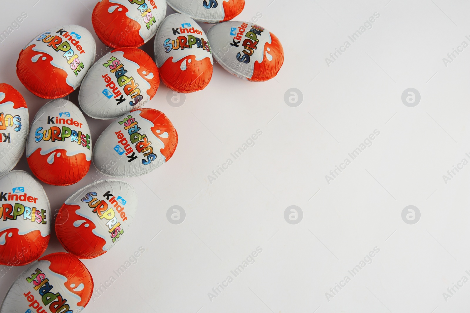 Photo of Sveti Vlas, Bulgaria - June 26, 2023: Kinder Surprise Eggs on white background, flat lay. Space for text