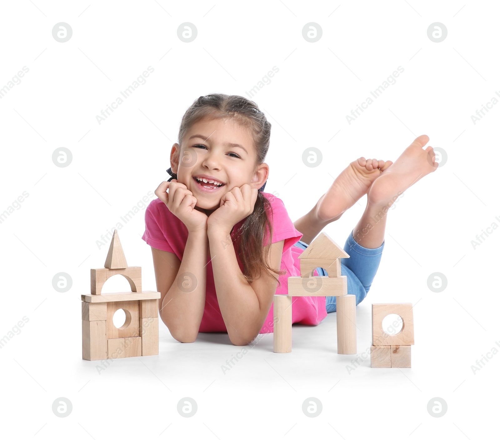 Photo of Cute child playing with wooden blocks on white background