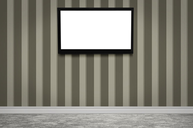 Modern TV on color wall in room. Space for design
