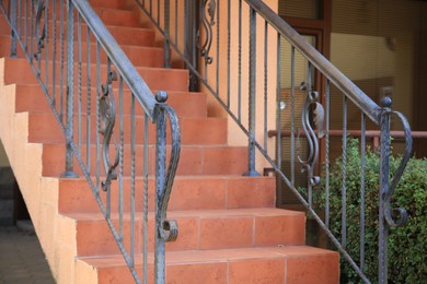 Photo of Viewbeautiful stairs with metal handrails near house outdoors