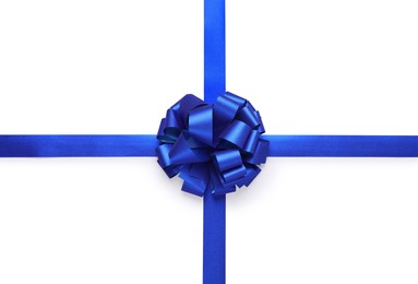 Blue ribbons with bow on white background, top view