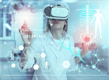 Medical technology concept. Doctor using virtual reality headset to study health data of patient
