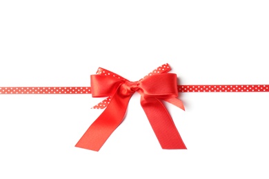 Red ribbon with bow on white background. Festive decoration