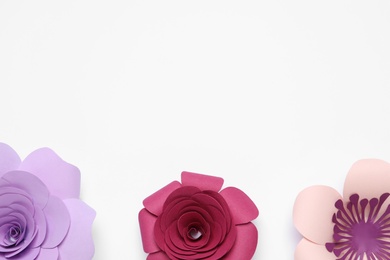 Photo of Different beautiful flowers made of paper on white background, top view