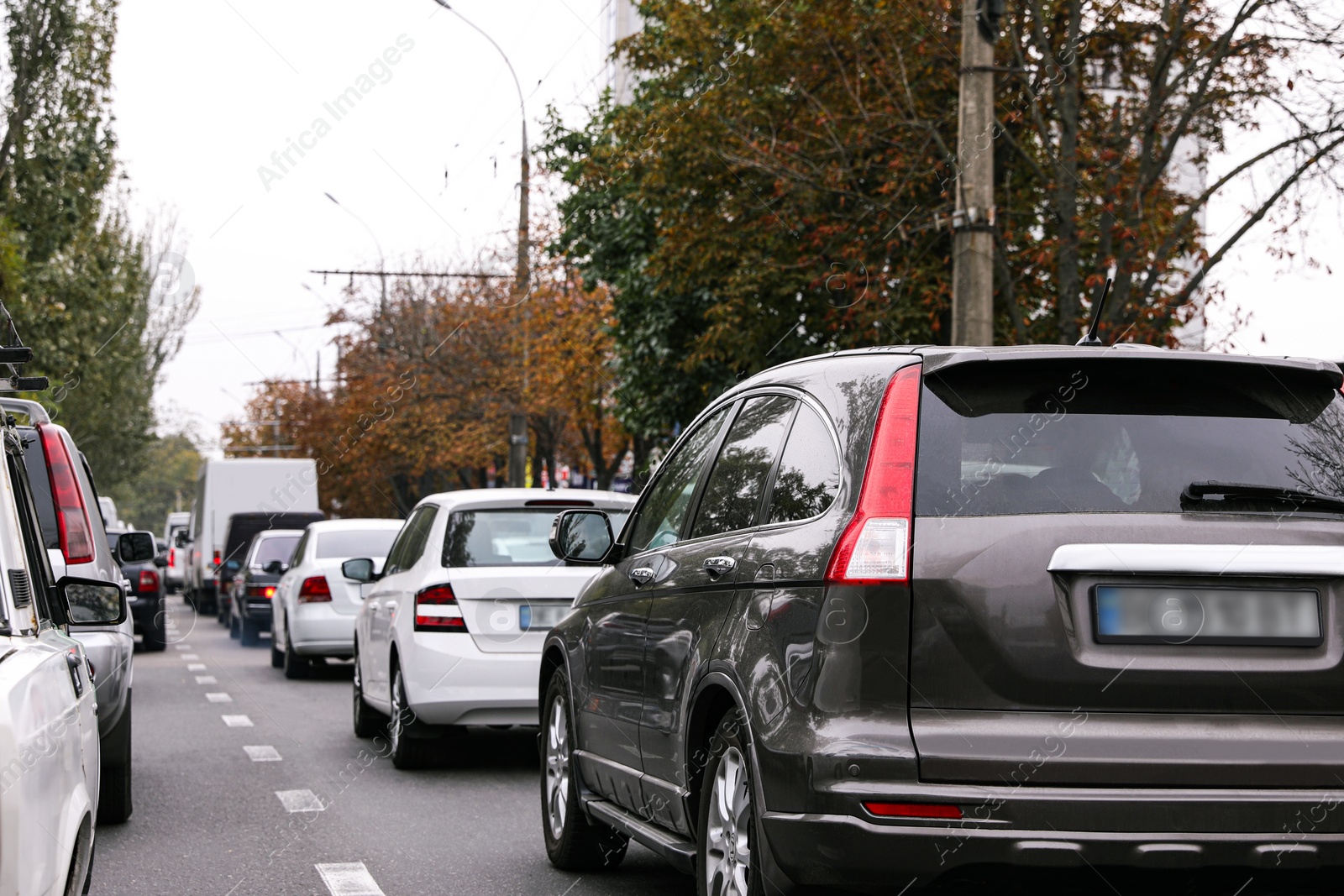 Photo of Heavy traffic jam on city street at rush hour