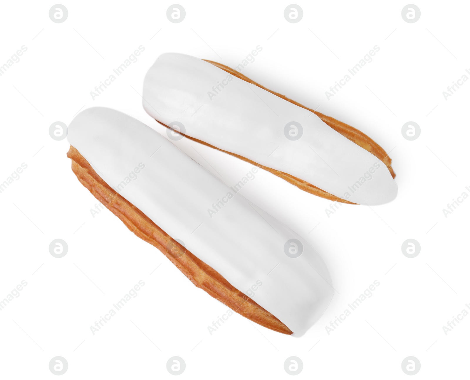 Photo of Two delicious eclairs covered with glaze isolated on white, top view
